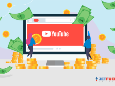 Two people placing YouTube logo on a computer screen with money raining down.