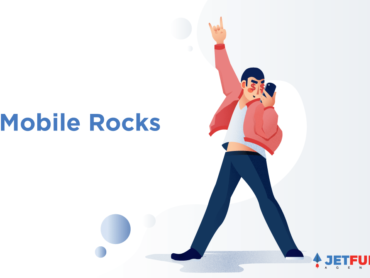 A rockstar artist looking at his phone with money signs on his eyes thinking that mobile rocks.